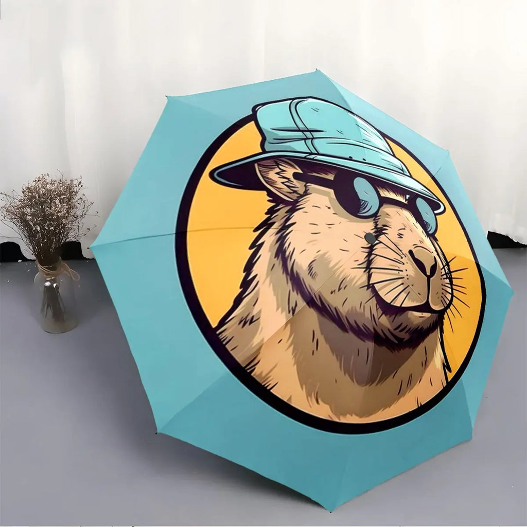 Folding umbrella Capybara wearing Fashion Glasses, blue hat, yellow background. Creative portable folding umbrella for Christm